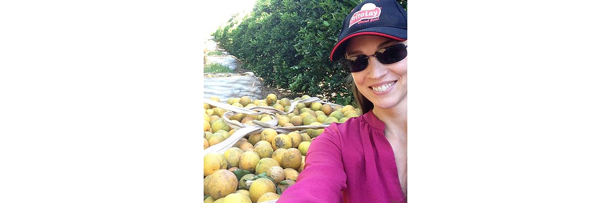 Margaret at an orange grove in Brazil