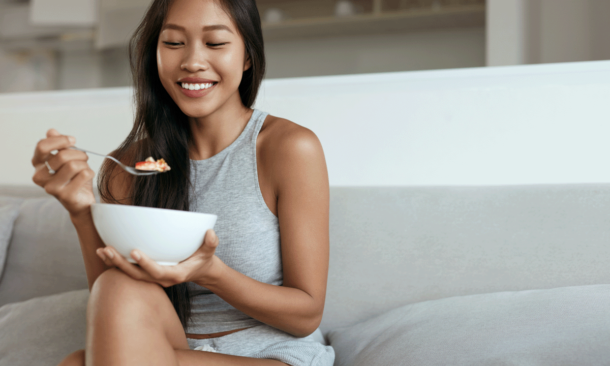 Woman enjoying a bowl of oatmeal