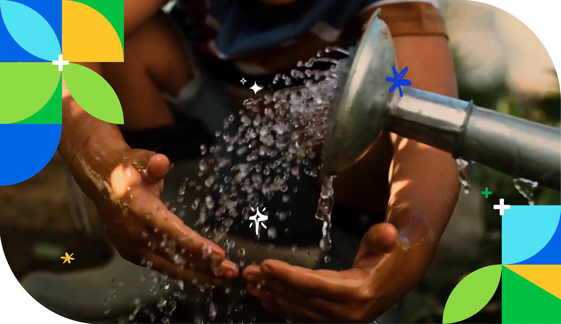Child's hands collect droplets of water from watering can